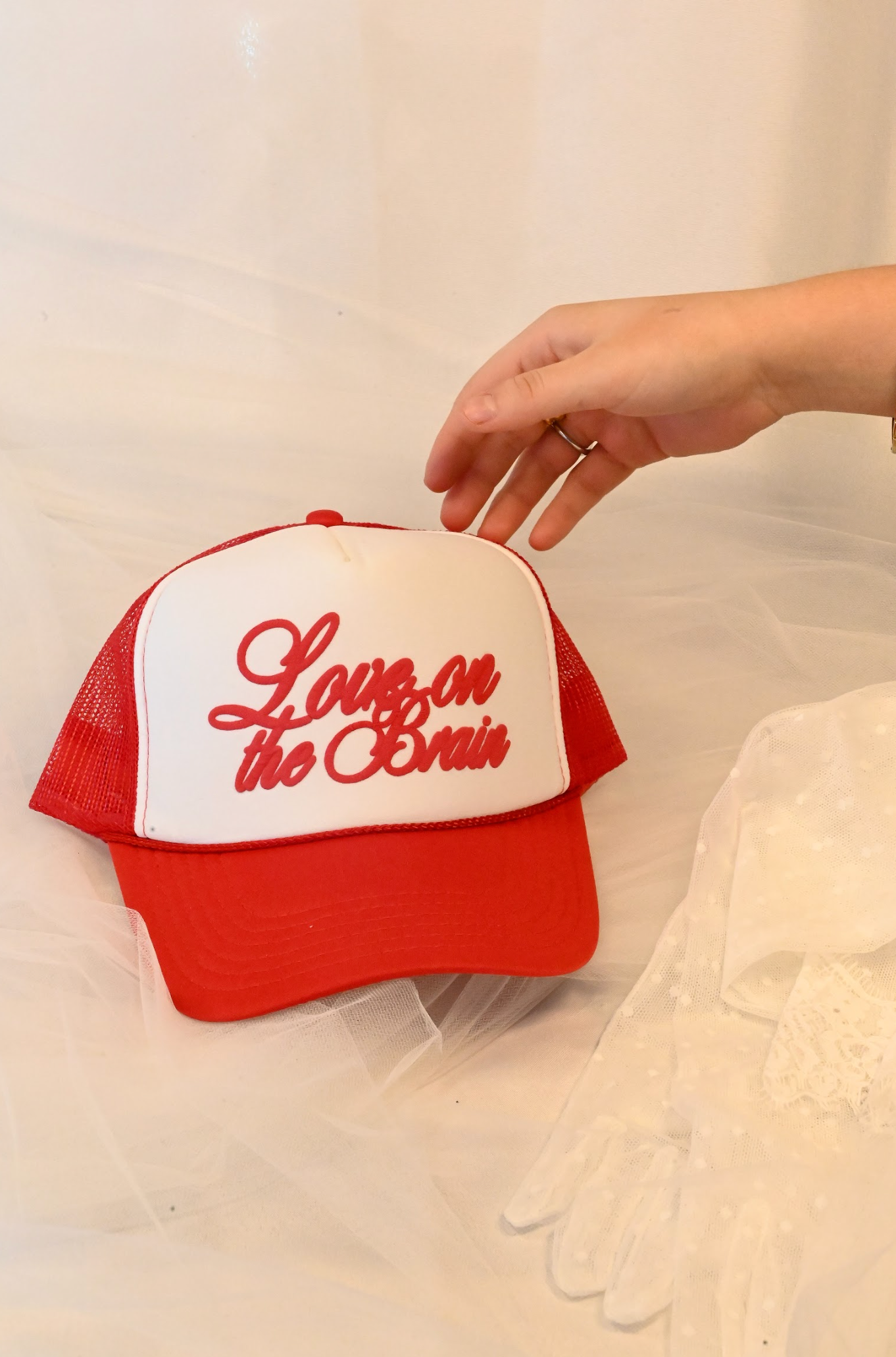 love on the brain trucker hat